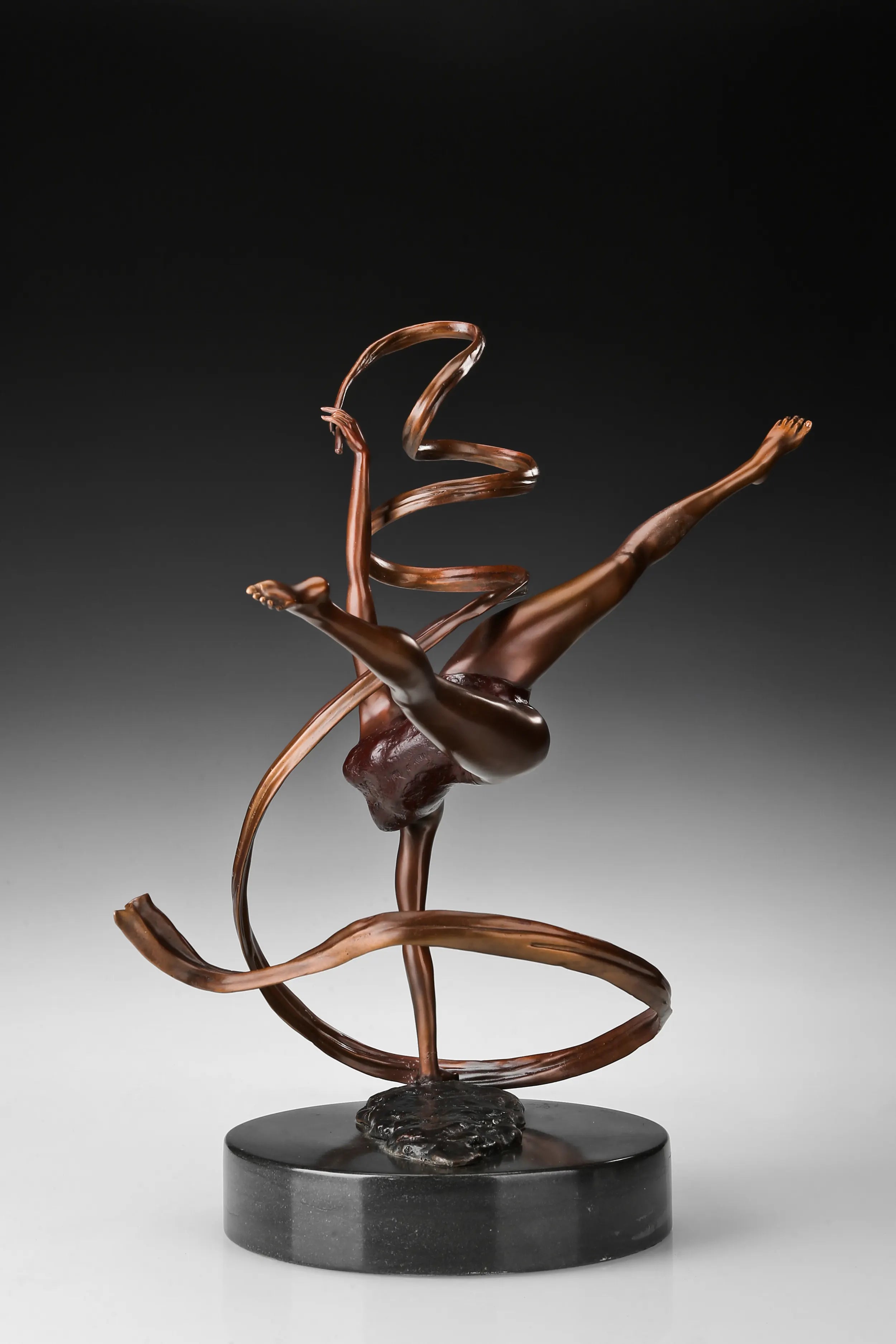 Bronze ribbon ballet dancer sculpture viewed from the opposite side showing the curved ribbon
