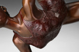 Detailed textured costume and warm bronze patina on the ribbon ballet dancer sculpture