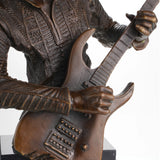 Close-up of bronze rock guitarist bust featuring expressive face and finely detailed electric guitar.