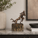 Rugby Tackle Bronze Sculpture displayed in a modern interior