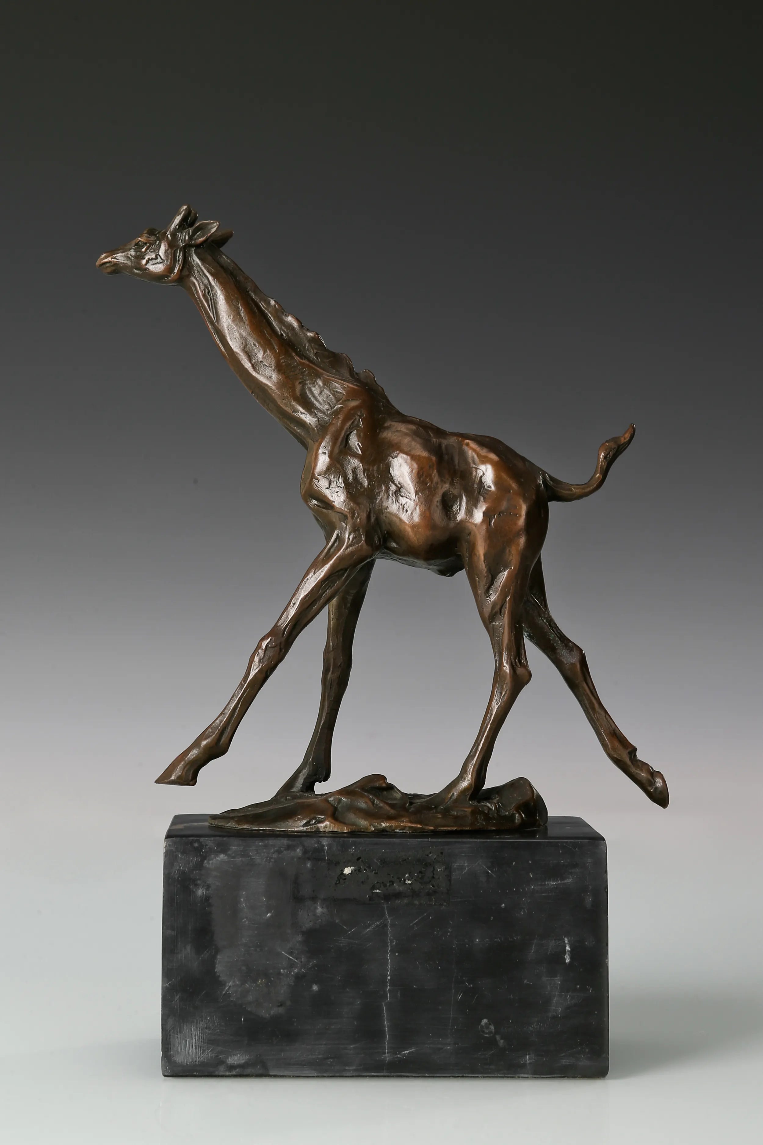Running Giraffe bronze sculpture rear view