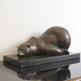 Left view of sleeping polar bear bronze sculpture with outstretched paws