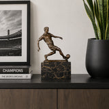 Soccer Player Bronze Sculpture displayed in a modern interior
