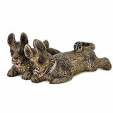Angled view of painted bronze sporting dog pack showing detailed fur collars and expressive faces