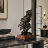 a realistic bronze owl sculpture with detailed feather textures and a striking red and black marble base. A symbol of wisdom, perfect for home, office, or library decor.