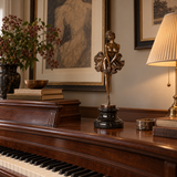 Vintage ballerina bronze sculpture displayed on a console in an elegant living room
