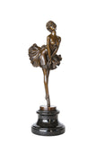 Vintage ballerina bronze sculpture with a flared tutu and graceful pointe pose