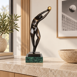 Abstract bronze volleyball athlete statue displayed as modern sports, team, and office decor