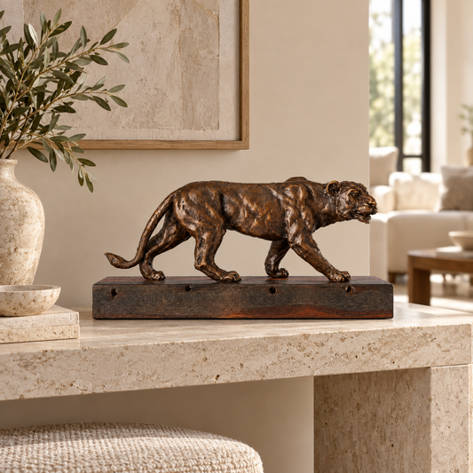 Walking Lioness Bronze Sculpture displayed in a minimalist interior