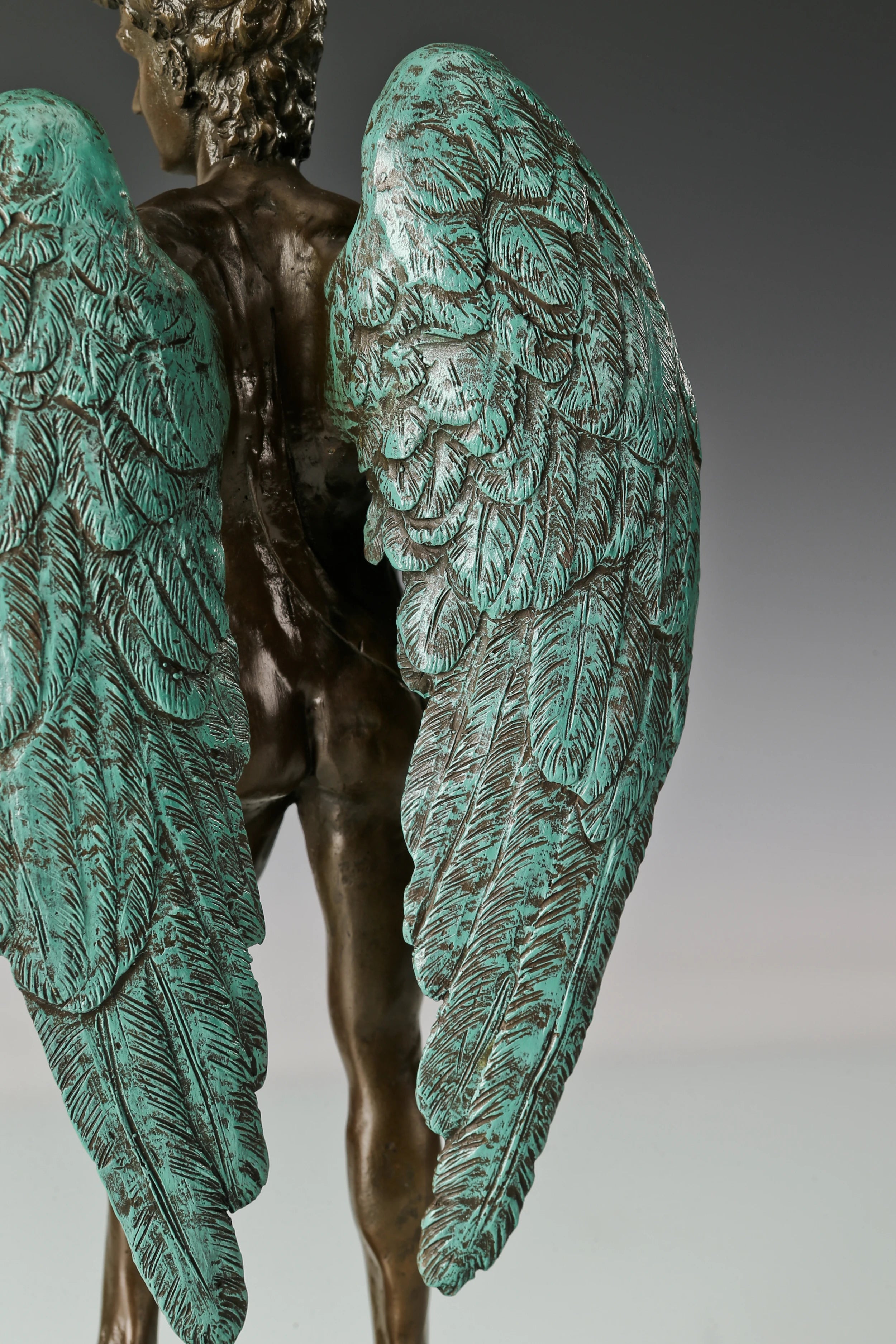 Detailed feather texture on Winged David bronze sculpture wings