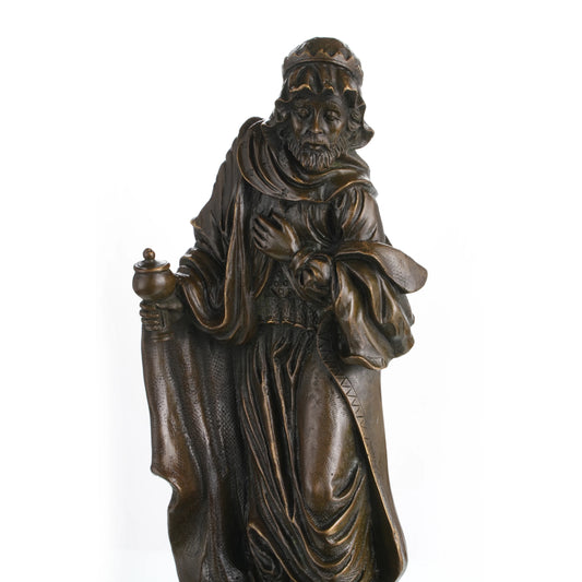 Close-up of wise man face with detailed beard in bronze