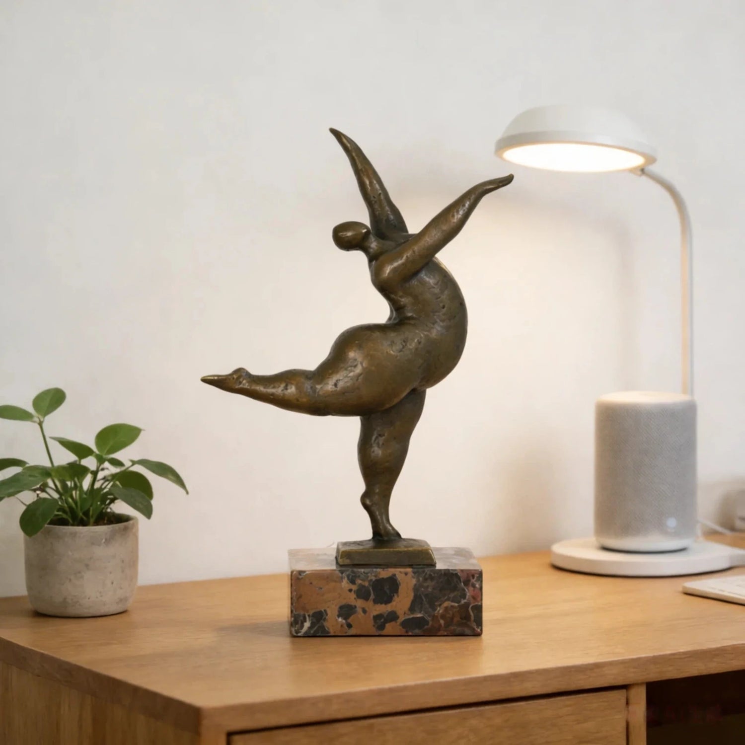 Modern dancing figure bronze sculpture with rounded abstract form on marble base, contemporary home decor
