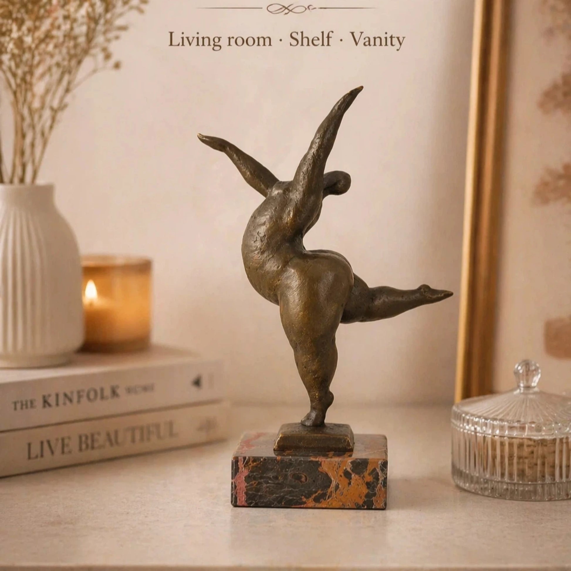 Abstract bronze female sculpture in a graceful dance pose on marble base, modern home decor accent