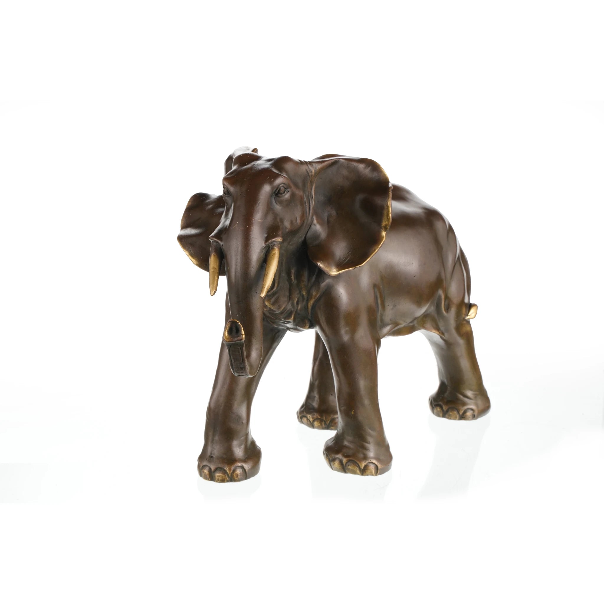 Majestic African elephant bronze statue featuring rich patina and polished highlights. A powerful wildlife sculpture symbolizing strength, wisdom, and prosperity.
