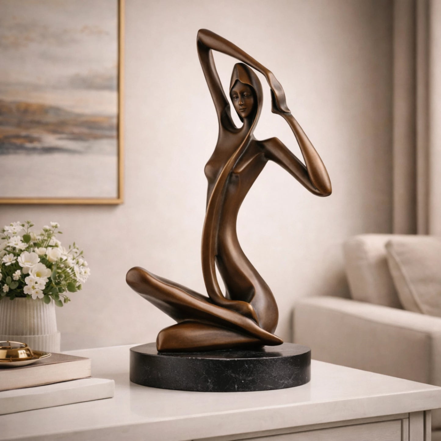 Art Deco bronze sculpture of a kneeling woman with raised arm and veil, stylized female figure on round black marble base, loss wax casting abstract art.