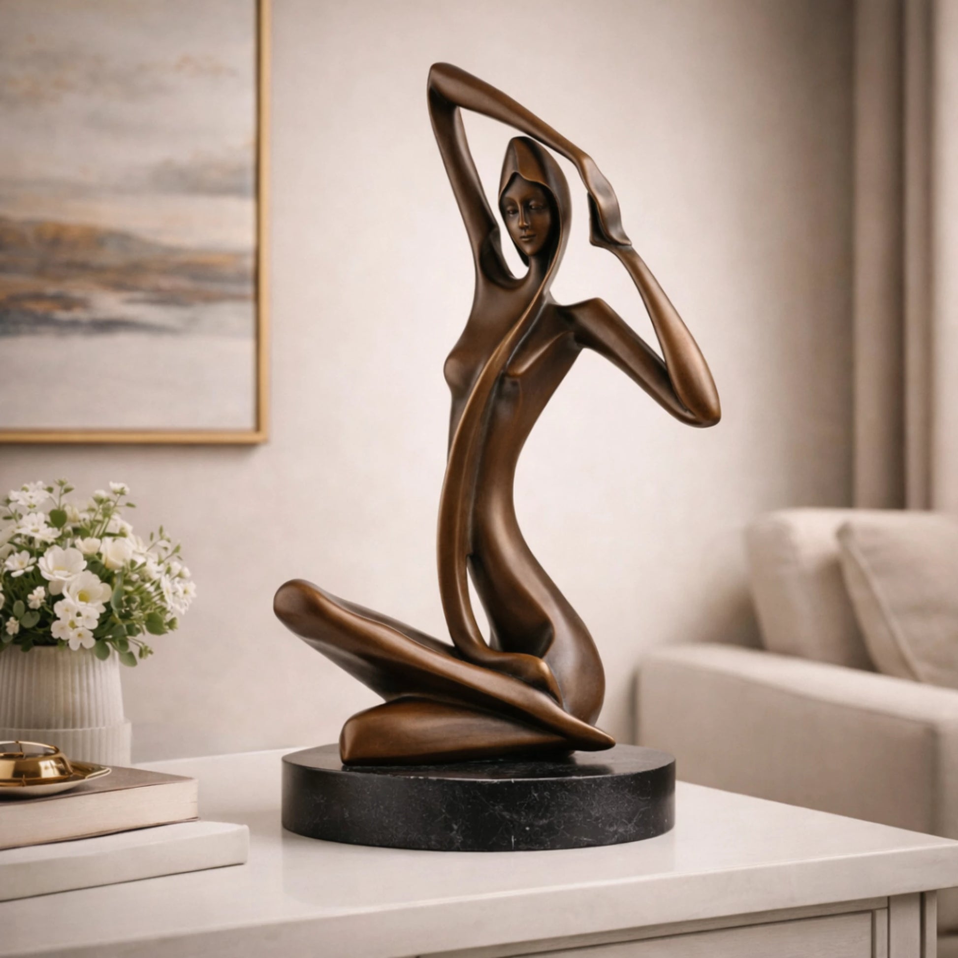 Art Deco bronze sculpture of a kneeling woman with raised arm and veil, stylized female figure on round black marble base, loss wax casting abstract art.