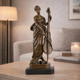 Elegant Art Nouveau bronze female cellist statue in flowing gown, woman playing cello sculpture on stepped black marble base, loss wax casting musical fine art.