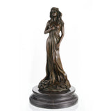 Elegant Art Nouveau bronze floral maiden sculpture with flowing gown and flowers, slender female figure on tiered circular dark marble base, loss wax casting fine art.