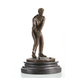 Bronze golfer statue putting with ball on marble base