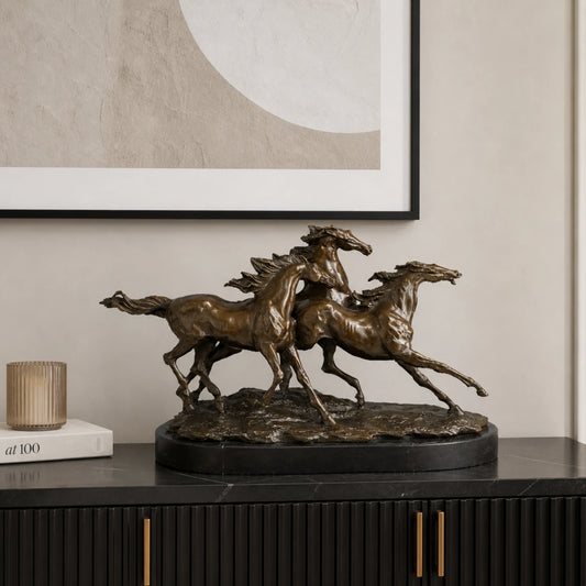 Dynamic bronze sculpture of three wild horses galloping as a herd, realistic running horse scene on oval black marble base, loss wax casting fine art.