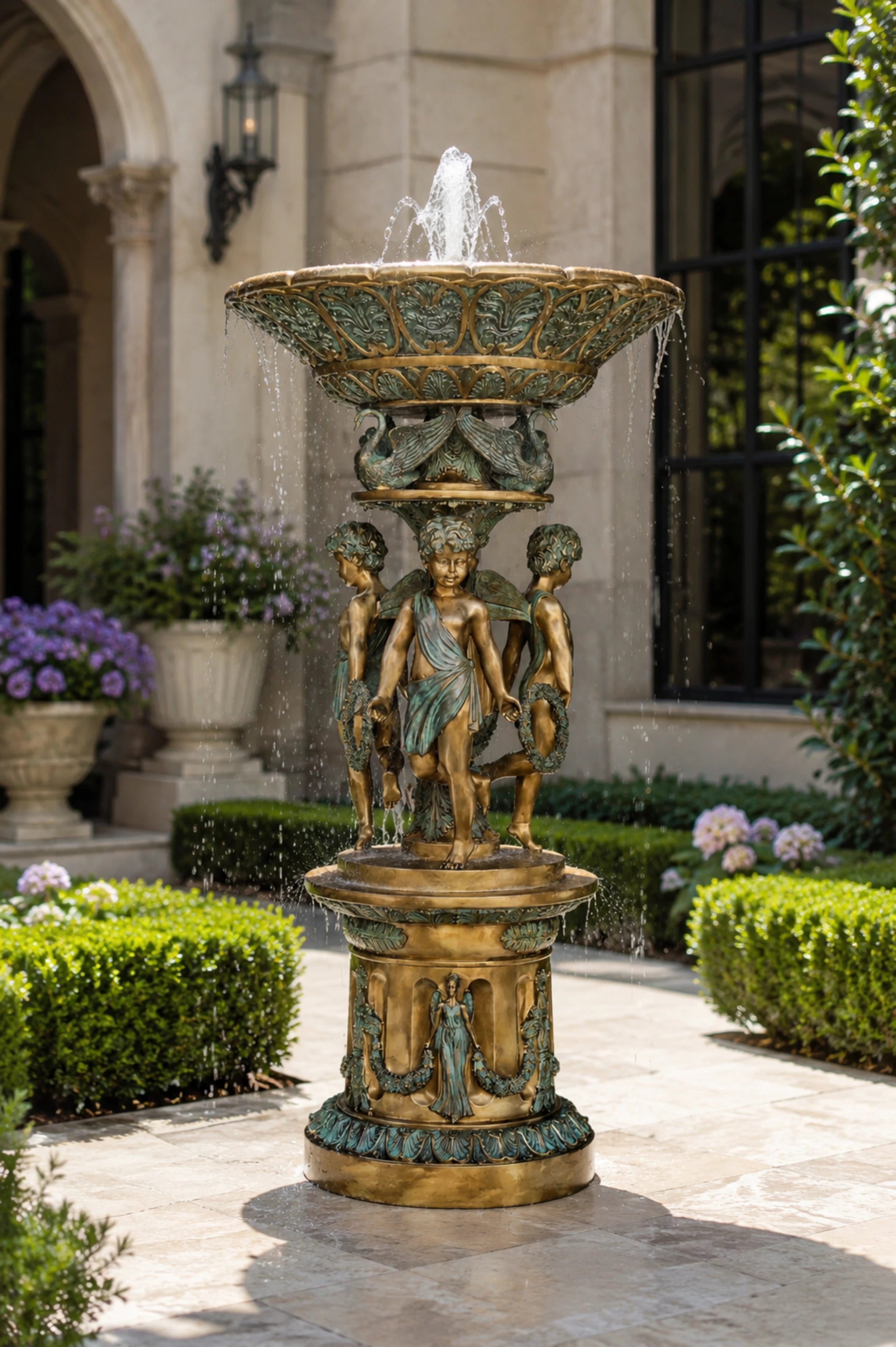 Handcrafted bronze Three Cherubs fountain featuring classical angelic figures, decorative swan motifs, and an elegant basin design. Ideal for luxury gardens, villas, courtyards, hotels, and landscape projects worldwide.