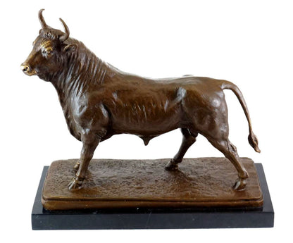 Handcrafted bronze standing bull sculpture featuring a rich patina finish and black marble base. A timeless symbol of prosperity, strength, and success for executive offices and luxury interiors.