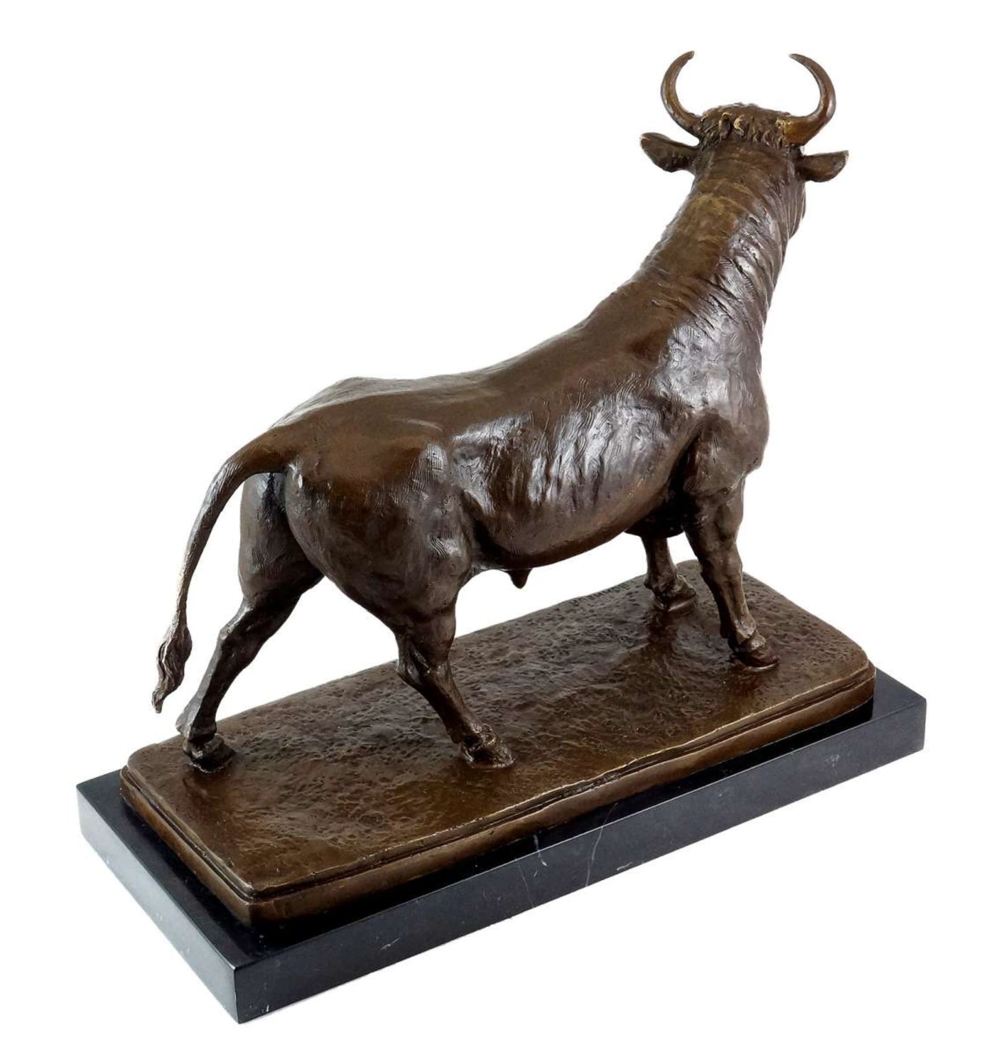 Handcrafted bronze standing bull statue with a rich patina finish and black marble base. A timeless symbol of prosperity, strength, and success for executive offices and luxury interiors.