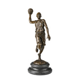 Handcrafted solid bronze basketball player sculpture captured in a dynamic one-handed layup pose. Lost-wax cast sports statue for players, coaches, clubs, offices, gifts, and art collections.