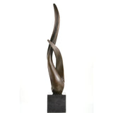 Minimalist abstract bronze sculpture of intertwined fluid forms, modern flame silhouette statue on square black marble base, loss wax casting symbolic art.