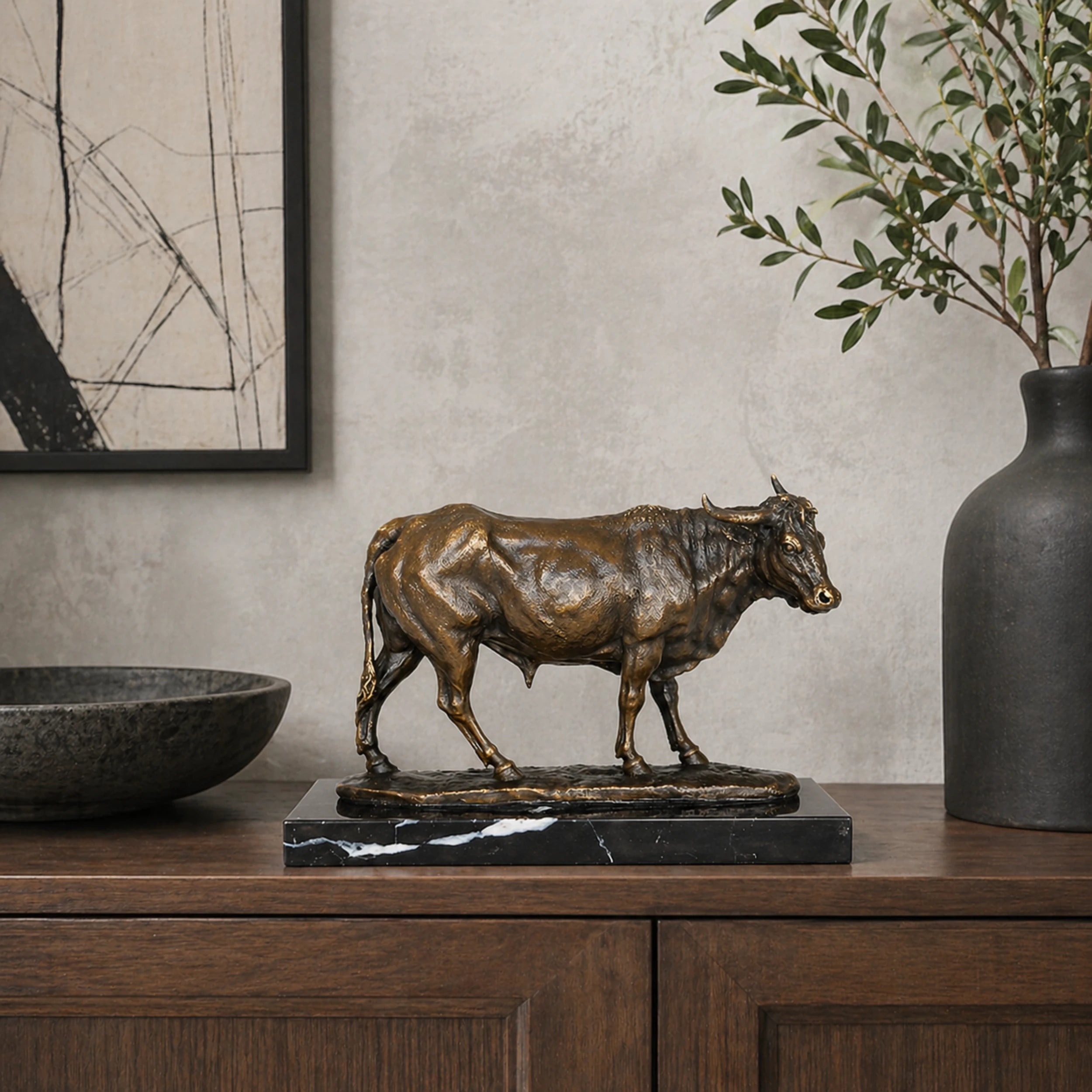 Naturalistic bronze walking bull sculpture with lifelike detail and strong posture