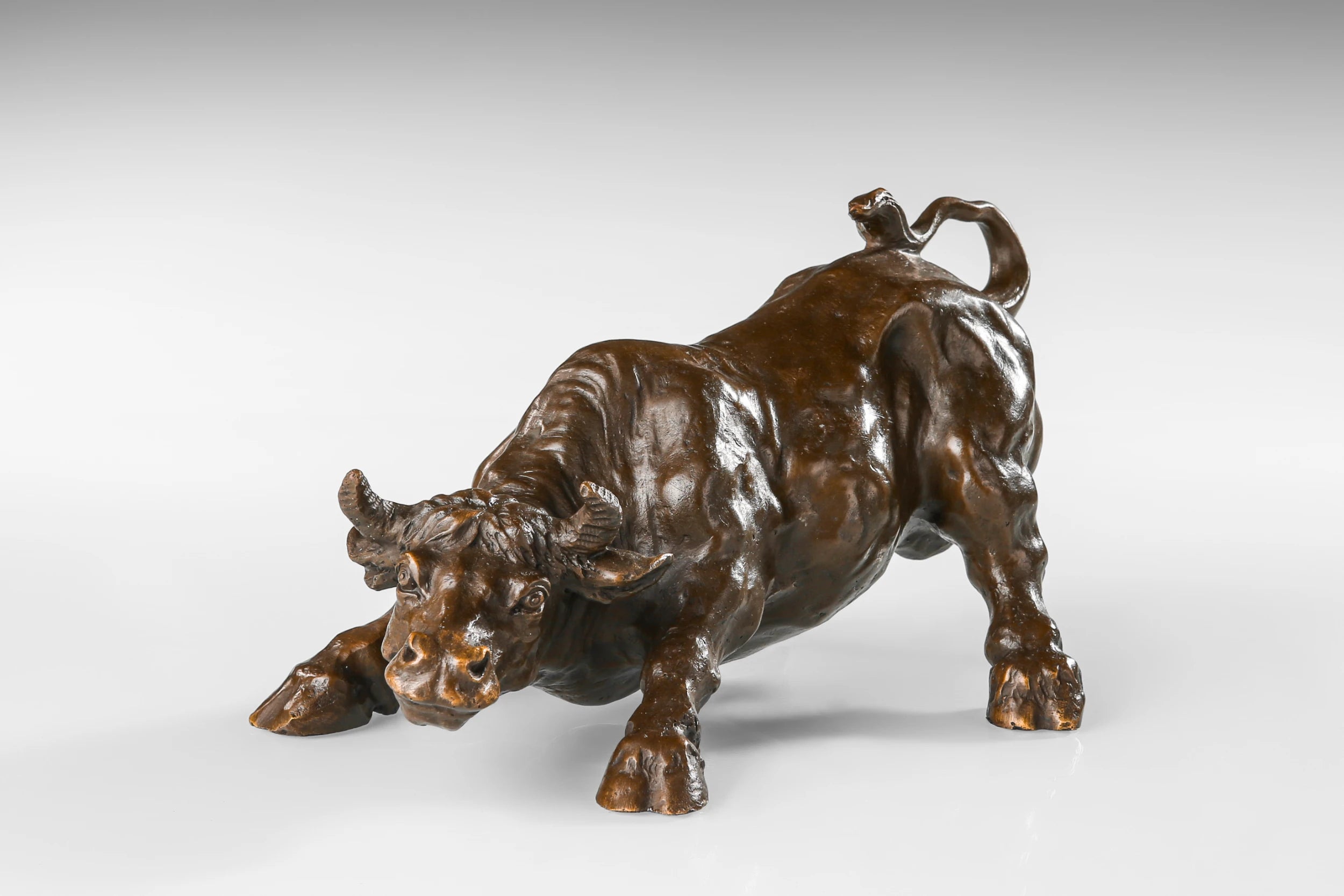 Powerful Wall Street Charging Bull bronze sculpture crafted using the lost-wax casting method. A timeless symbol of strength, resilience, prosperity, and bull market energy.