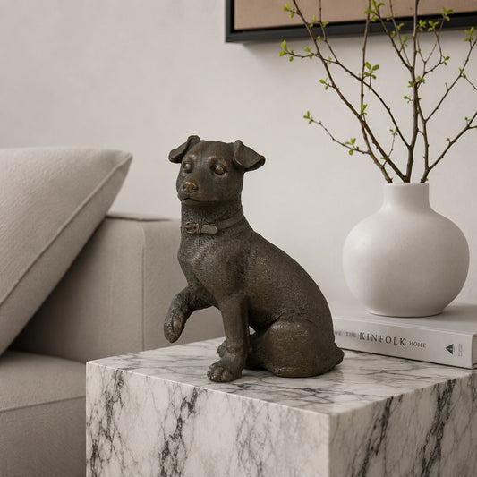 Realistic bronze terrier sculpture crafted using the lost-wax casting method. A charming seated dog statue symbolizing loyalty, energy, and companionship.