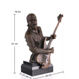 Realistic bronze rock guitarist bust with electric guitar, music themed sculpture on black marble base, edgy decor for recording studios.