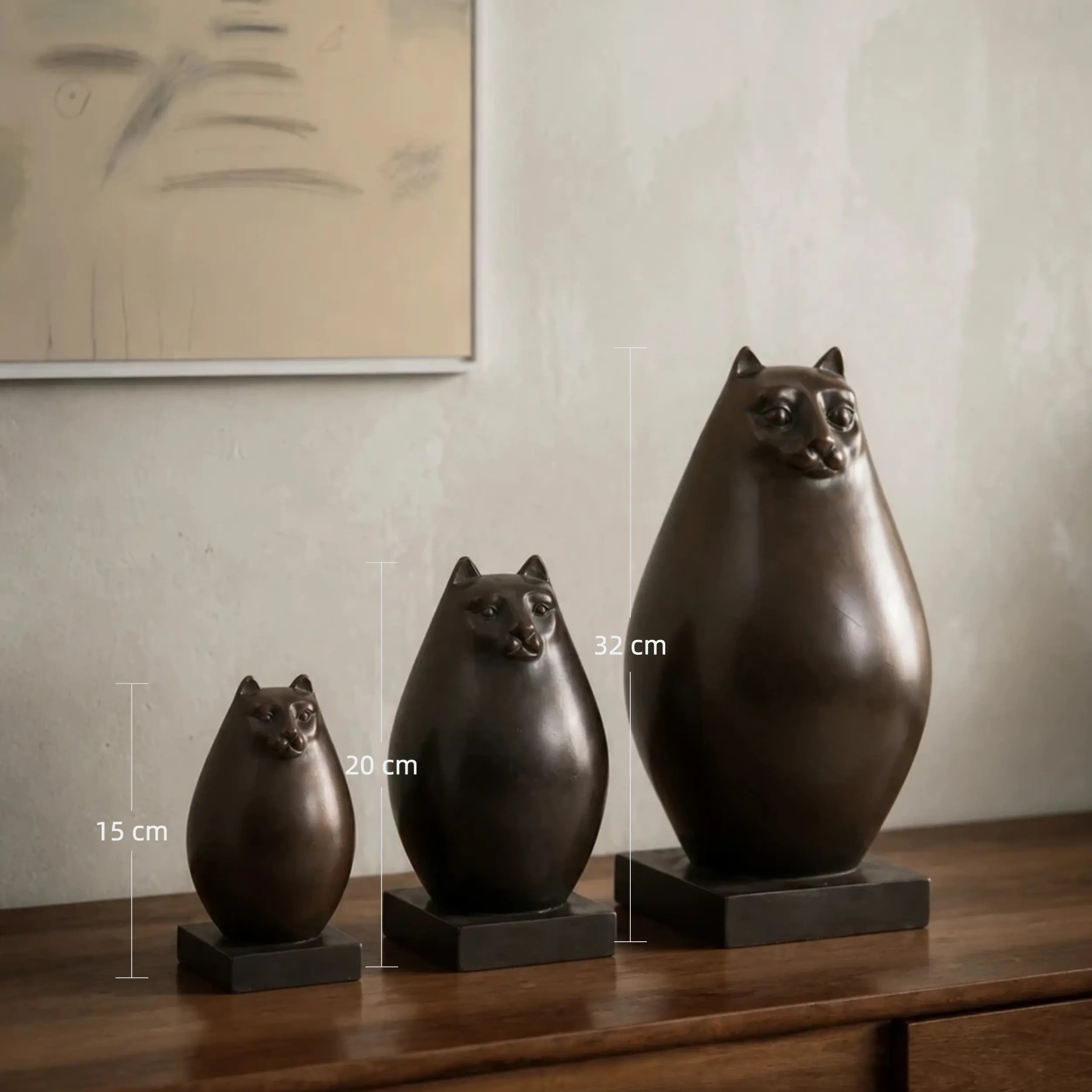 Set of 3 abstract cat bronze statues with oval forms in graduated sizes. Handcrafted modern cat decor for living rooms, consoles, bookshelves and offices.
