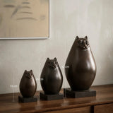 Set of 3 abstract cat bronze statues with oval forms in graduated sizes. Handcrafted modern cat decor for living rooms, consoles, bookshelves and offices.