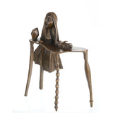 Surrealist bronze sculpture of female figure emerging from melting table, Dalí-inspired abstract art on black marble base, loss wax casting fine art.