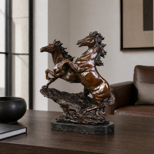 Dynamic bronze sculpture of two rearing horses in synchronized motion, realistic dual stallion statue on veined black marble base, loss wax casting fine art.