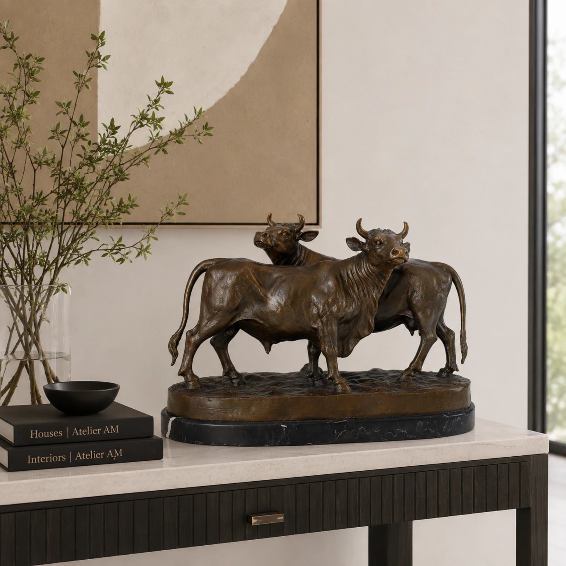 Detailed bronze cattle sculpture of a bull and cow standing together, realistic livestock statue on veined black marble base, loss wax casting fine art.