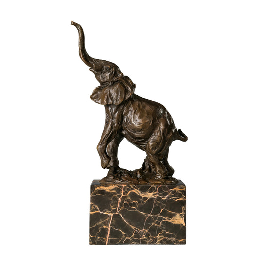 This is a dynamic bronze sculpture of an elephant calf, crafted using the lost-wax casting method and bearing the signature of the artist. 
