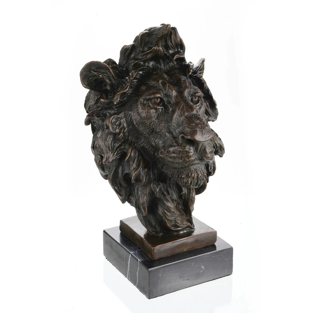 This is a powerful bronze bust of a lion, crafted using the lost-wax casting method. The sculpture focuses on the lion’s head and upper neck, capturing the animal in a moment of intense focus and regal authority. 