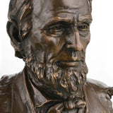 Realistic Abraham Lincoln bronze bust on black marble base, luxury executive office decor, historical American president statue.