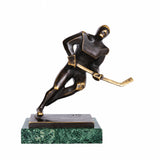 Handcrafted abstract bronze ice hockey player sculpture holding a hockey stick in a dynamic skating pose