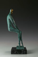 Opposite side view of contemporary bronze couple sculpture with elongated legs