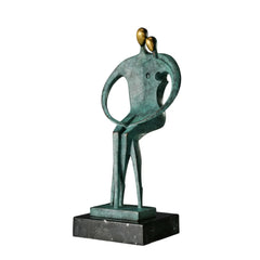 Abstract bronze couple statue with intertwined figures, green patina, and black marble base