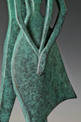 Close-up of the overlapping arms and bodies of the abstract bronze couple
