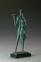 Left angled view of abstract couple sculpture with a small bird held in an outstretched hand