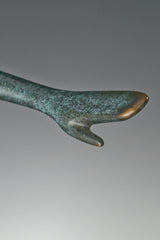 Close-up of abstract female dancer bronze statue showing her hand
