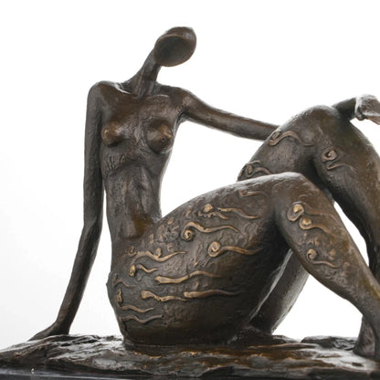 Minimalist female upper body detail in bronze art