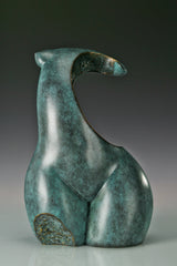 Front view of modern abstract female torso sculpture with textured gold accents