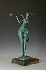 Three-quarter view of abstract flute player bronze sculpture with a bird on the flute